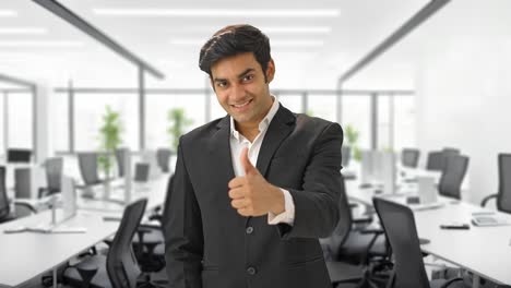 Happy-Indian-businessman-showing-thumbs-up-sign