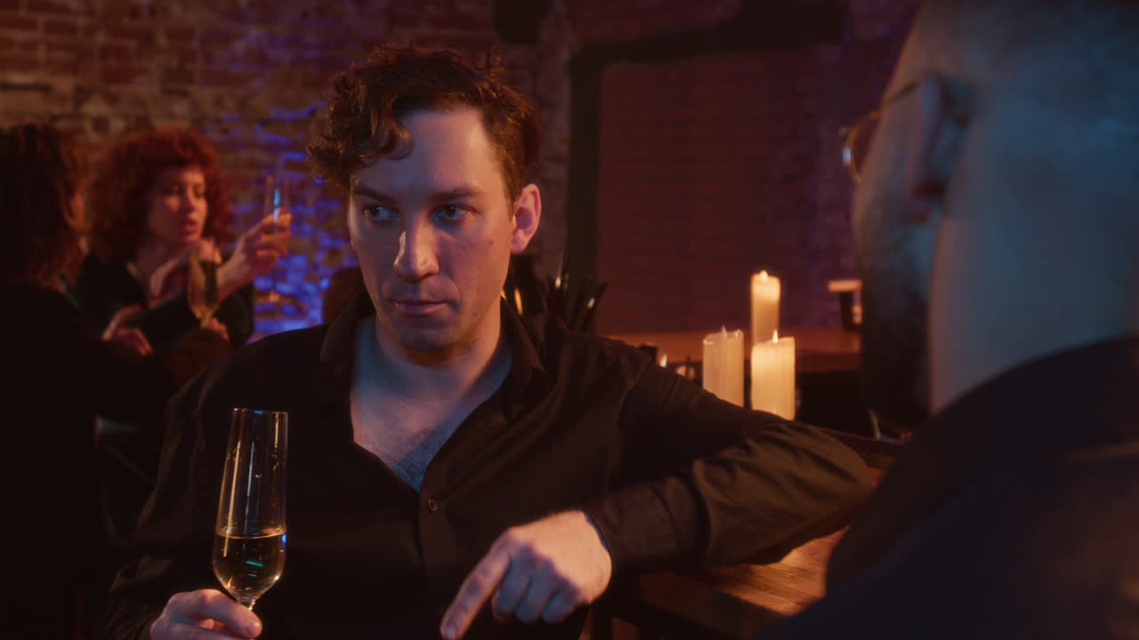 People celebrating at a bar with champagne