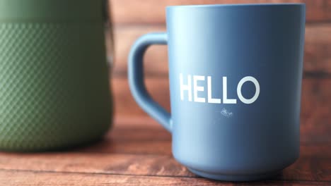 blue mug with the word hello