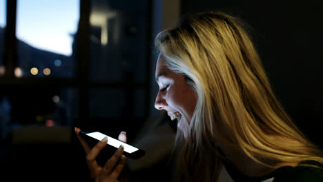 woman talking on mobile phone at home 4k