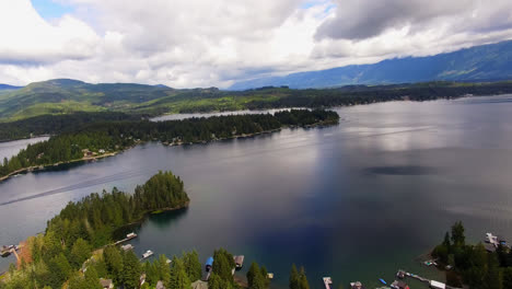 Aerial-Panoramic-View-of-Coastal-Neighborhood-Marina-Along-River-Shoreline-in-Port-Alberni,-British-Columbia-Canada,-Island-and-Mountains-in-Horizon