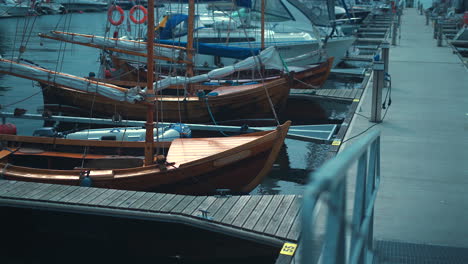 wooden boats and yachts moored in the marina at sunny summer day