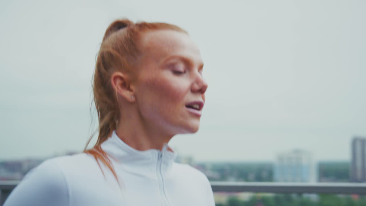 Redhead Woman Running on Rooftop