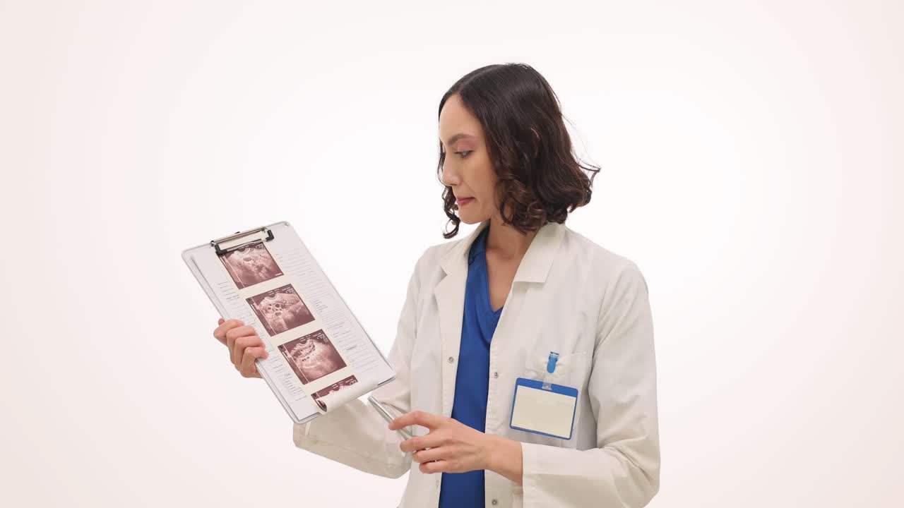 Female Doctor Examining Medical Scans on a Clipboard