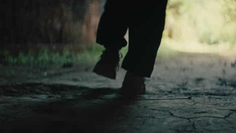 person walking through a tunnel
