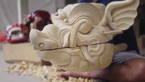 opening mouth of a finished balinese wooden barong mask