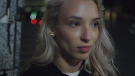 Beautiful-woman-night-city-face-looking-in-street-lights.-Girl-standing-outside.