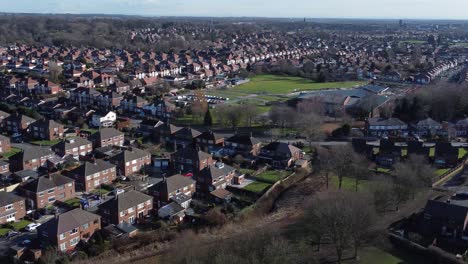 typical suburban village residential neighbourhood manchester home rooftops aerial view pan right