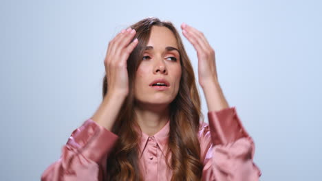 stressed woman touching head with hands. entrepreneur having stress after work