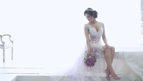 slow motion young bride in white long lacy dressing