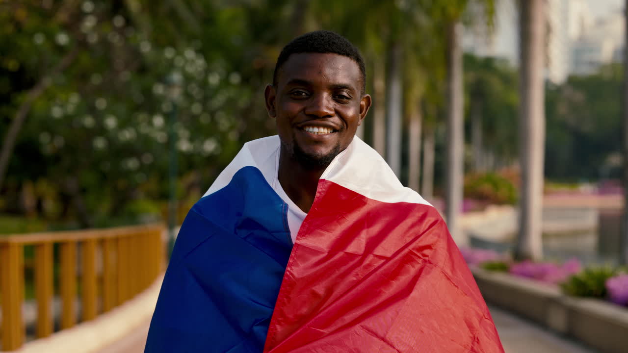 Smiling Man Holding French Flag