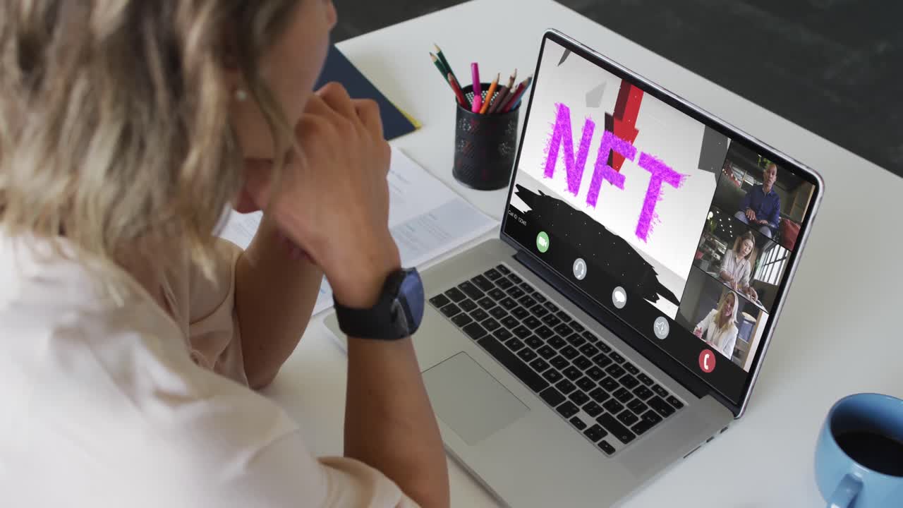 Video of caucasian woman having nft video call on laptop with diverse coworkers