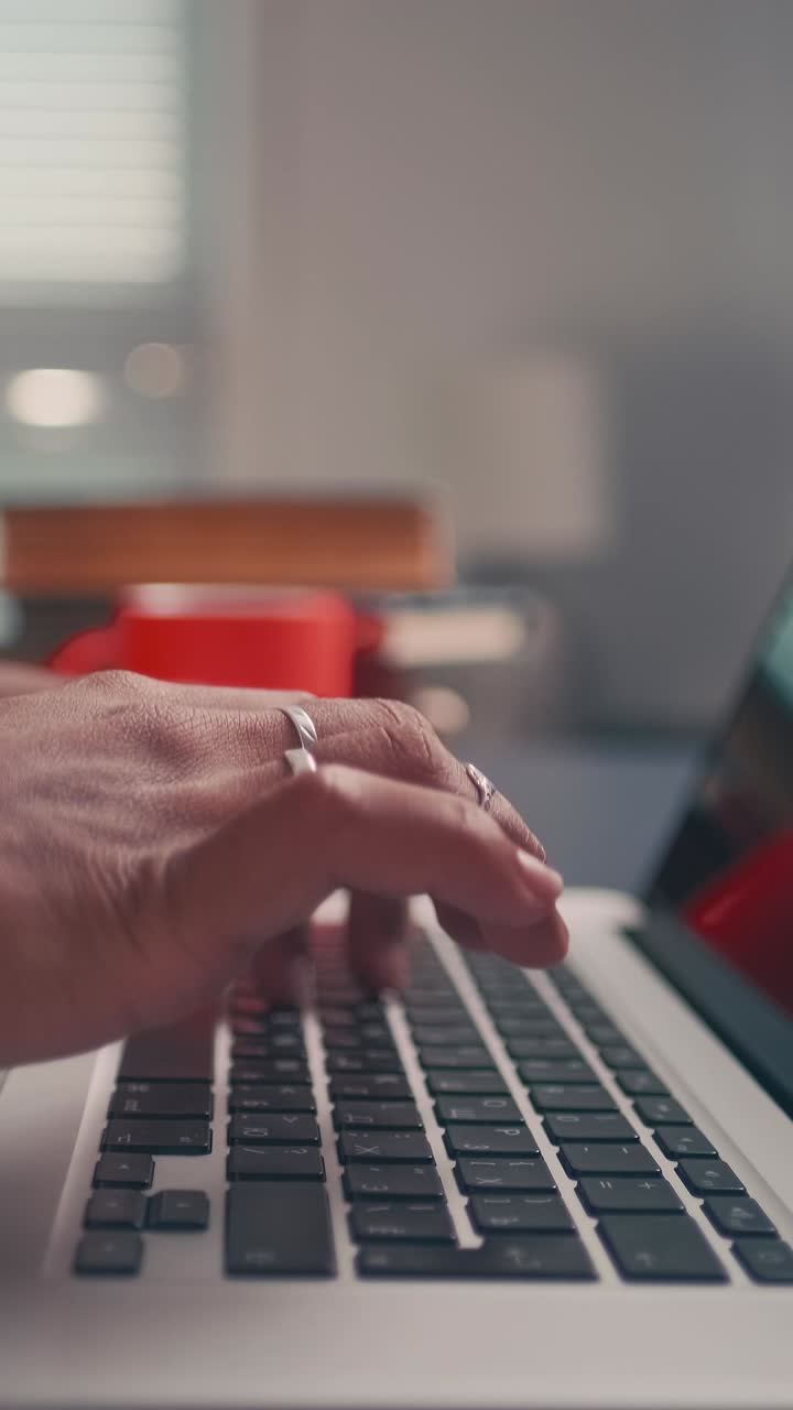 Close up of person hands typing on laptop keyboard text for email message