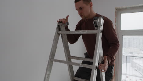 couple doing home improvement: painting a room