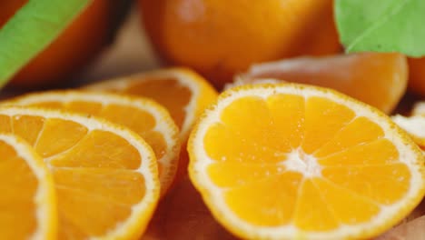round slices of ripe tangerine rotating slowly.