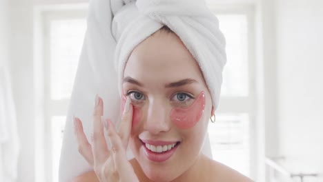 Portrait-of-happy-caucasian-plus-size-woman-with-bathrobe-doing-make-up-in-slow-motion