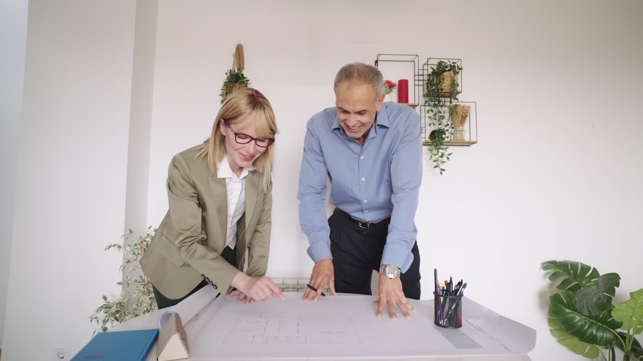 Architects Collaborating on a Blueprint