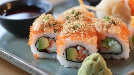 sushi rolls with avocado and sesame seeds