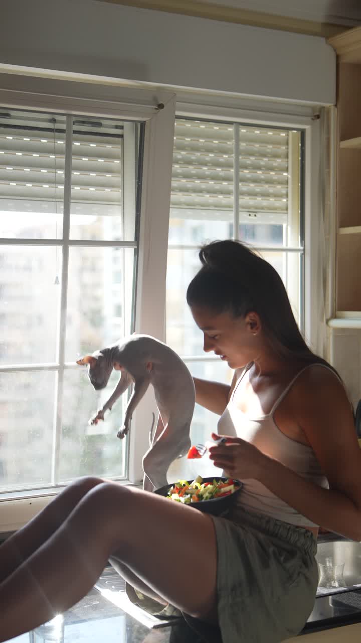 Woman Eating Salad in Kitchen