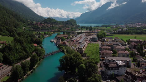 Beautiful-aerial-flight-along-the-turquoise-Aere-River-in-the-town-of-Interlaken