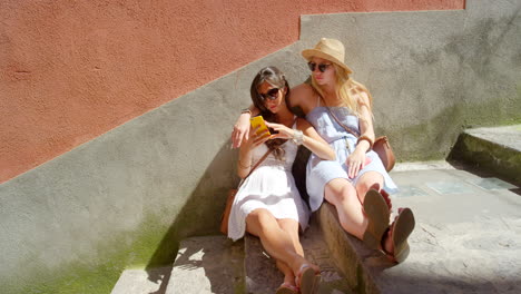 Phone,-stairs-and-happy-relax-friends-watch-funny