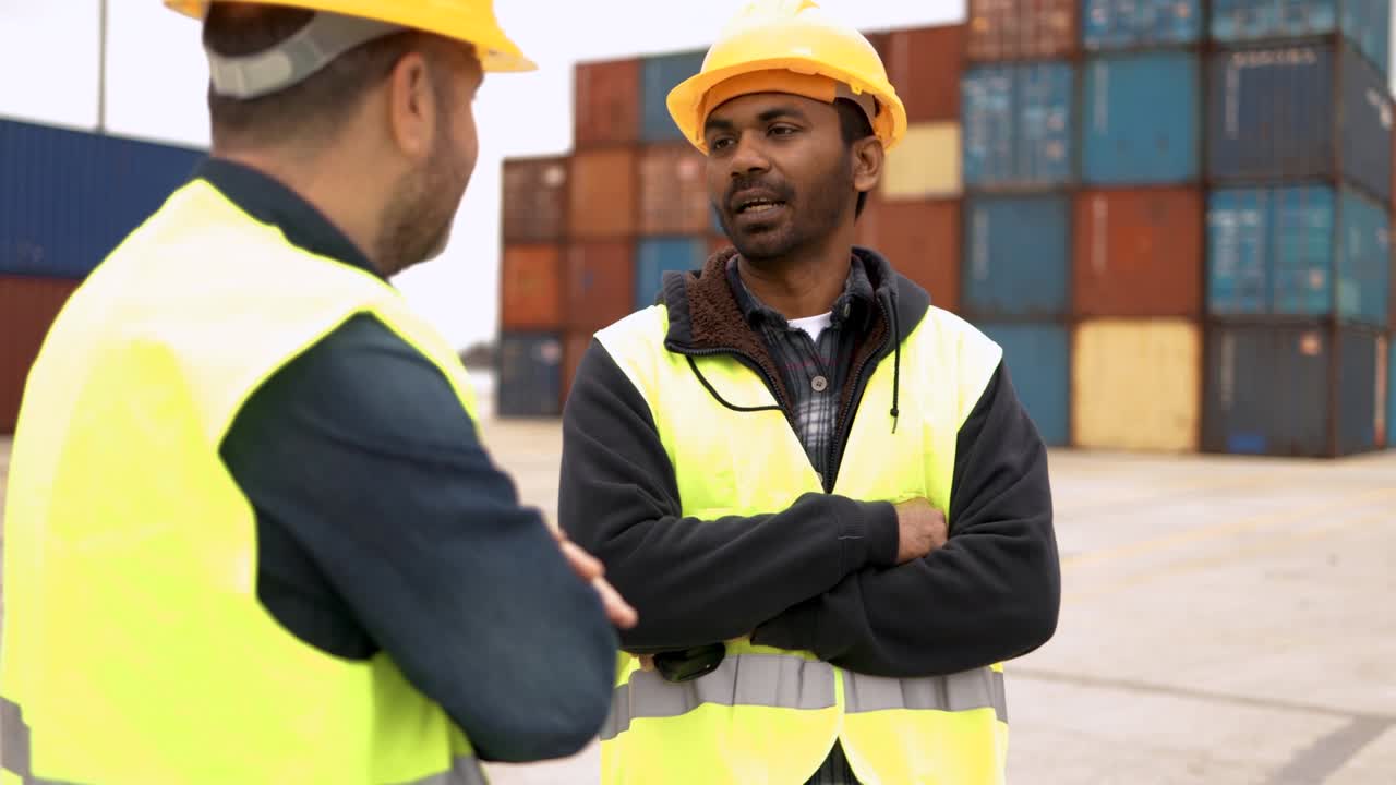 Multiracial industrial operators working inside international containers port terminal - Freight logistics operations