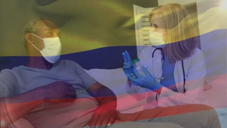 Animation-of-flag-of-colombia-over-caucasian-female-doctor-with-pills