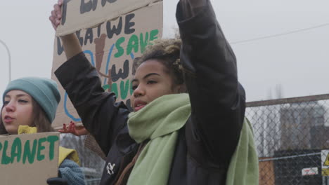 Group-Of-Young-Female-Activists-With-Banners-Protesting-Against-Climate-Change-1