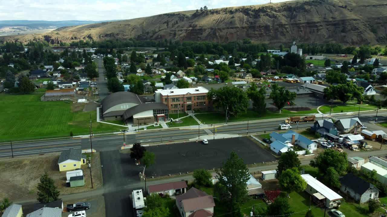 US, Oregon, Wallowa, 2025-08-18 - Drone view of the city of Wallowa, a small farming town in northeast oregon. Orbiting the city school