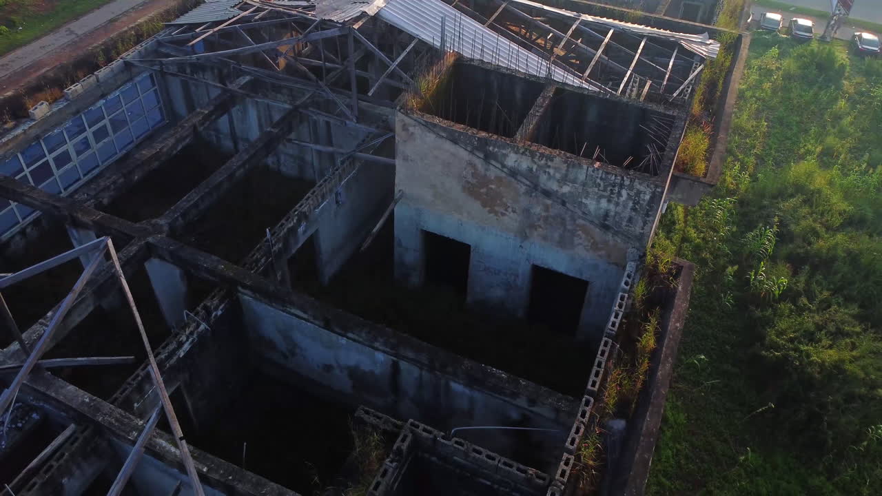 Close aerial of a ruined building with a missing rooftop