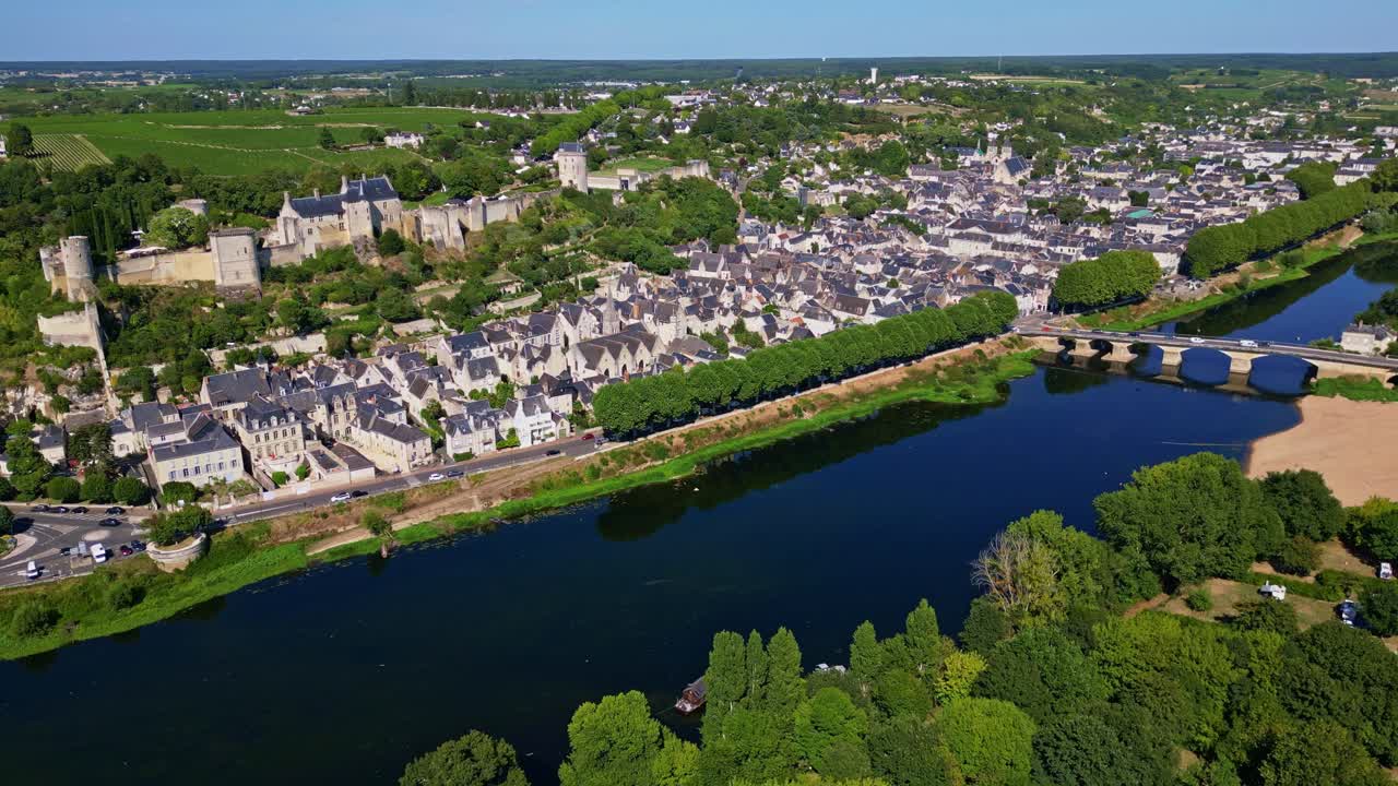 Panoramic drone fly near the French Vienne River about the medieval Forteresse Royale de Chinon, Indre-et-Loire, France