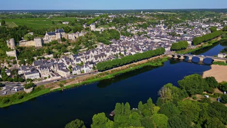 Panoramic drone fly near the French Vienne River about the medieval Forteresse Royale de Chinon, Indre-et-Loire, France