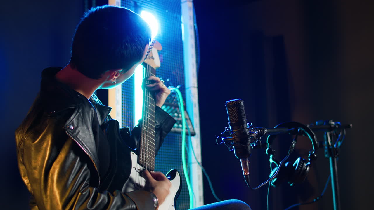 Musician Recording Music in Studio