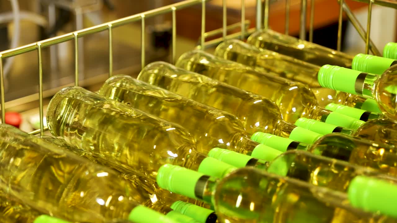 White Wine Bottles Stacked in racks in Winery Storage Facility
