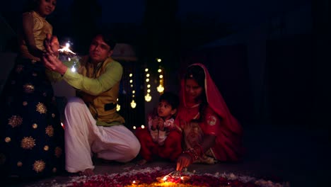 parents with kids celebrate the indian traditional festival of diwali