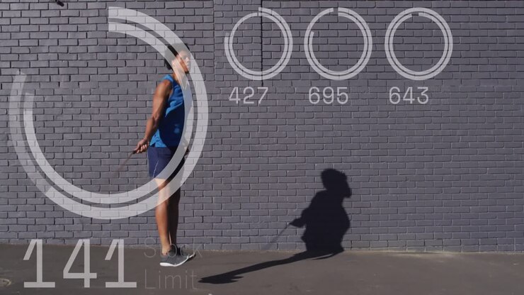 Animation of data processing over african american man jumping rope