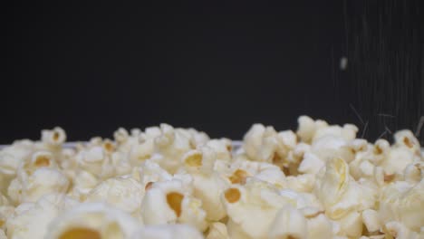 macro view of salt falling on the popcorns