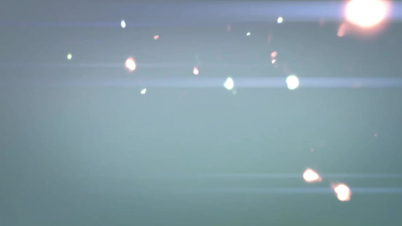 Abstract Light Flares and Glowing Particles Transitioning on Dark Background