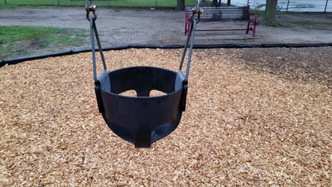 empty baby swing chair moving left to right