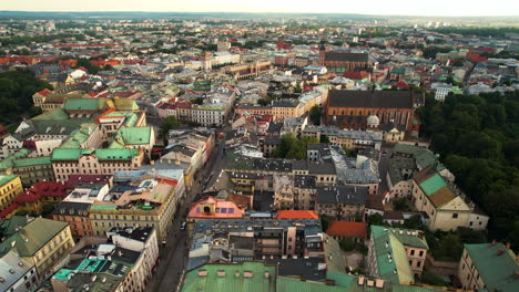 Aerial-drone-shot-over-beautiful-old-city-of-Cracow-in-Poland-at-sunrise