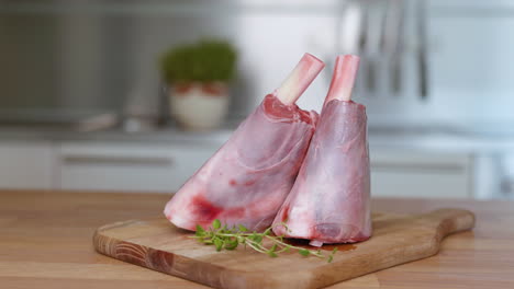 lamb shanks on cutting board - slider right