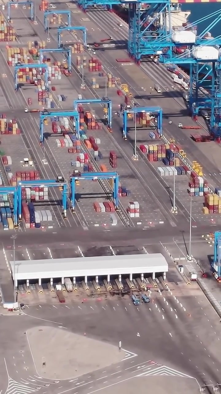 Container terminal in Accra, Ghana with many stacked shipping containers