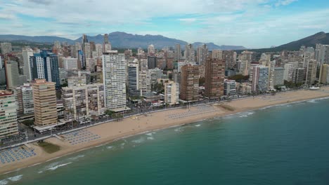 Benidorm-City,-Beach-Promenade-and-Skycrapers-at-Costa-Brava,-Spain---Aerial-4k