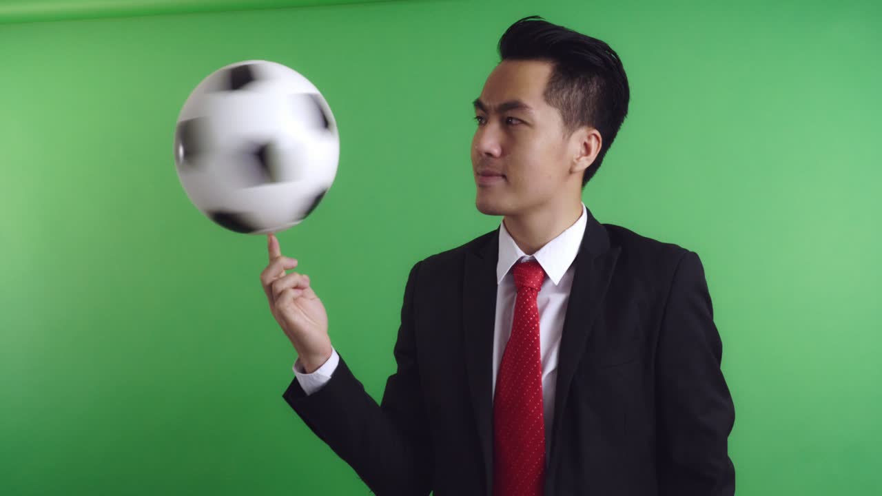 Businessman Juggling a Soccer Ball