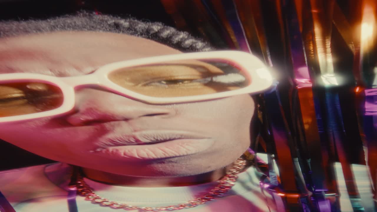 African American Man Rapping Expressively to Camera in Nightclub