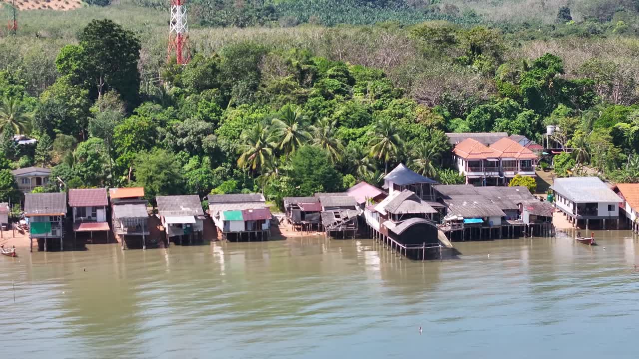 Fishing village in Koh Lanta, Thailand. Drone close up to the elevated homes above sea level.