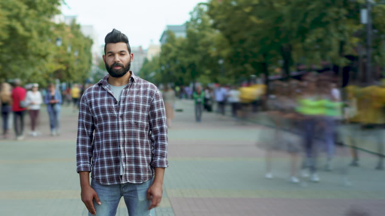 Man in Plaid Shirt on City Street