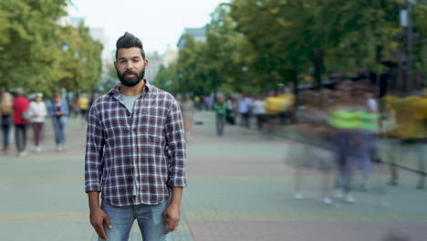 man in plaid shirt on city street