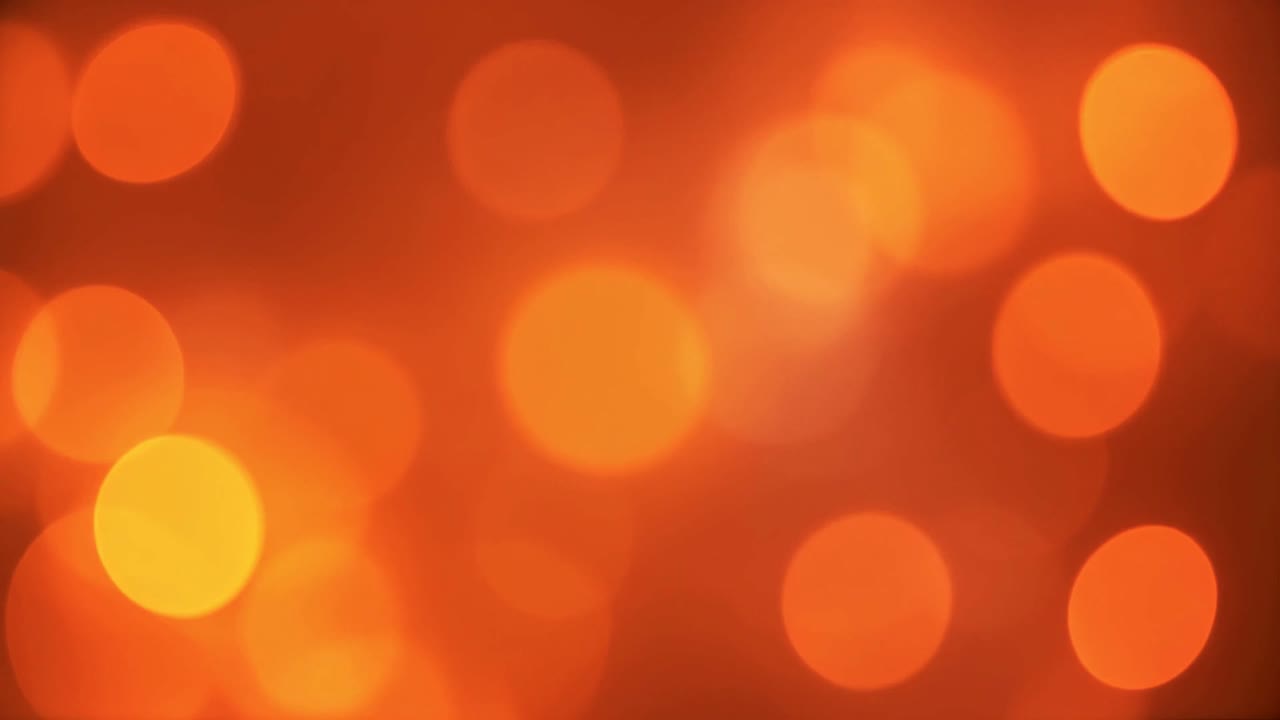 Warm Orange Bokeh Lights Shimmering Abstract Background