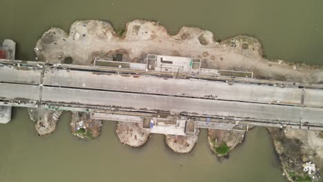 aerial view of pandansimo bridge in yogyakarta, the southern java cross bridge is under construction. adjacent to baru beach.